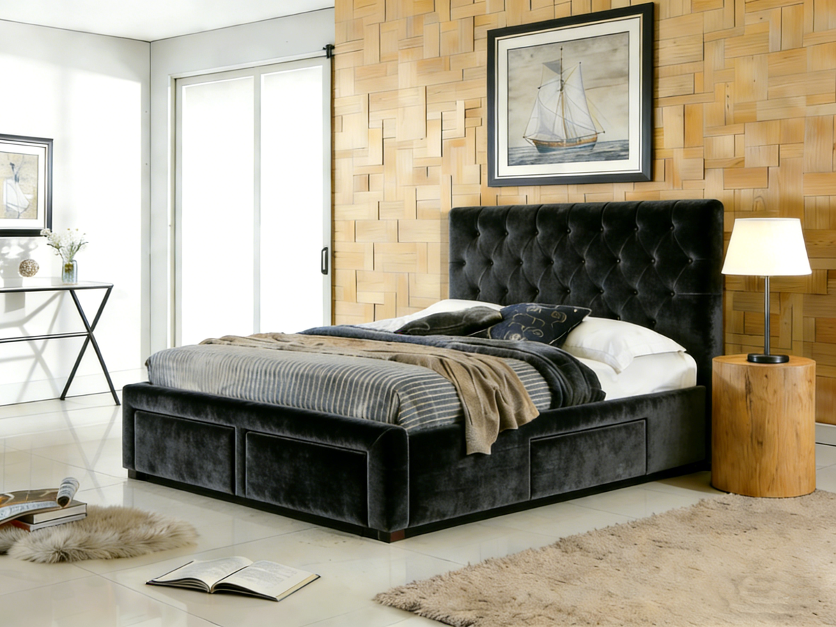 Gray upholstered bed in a modern bedroom with wooden wall and lamp.