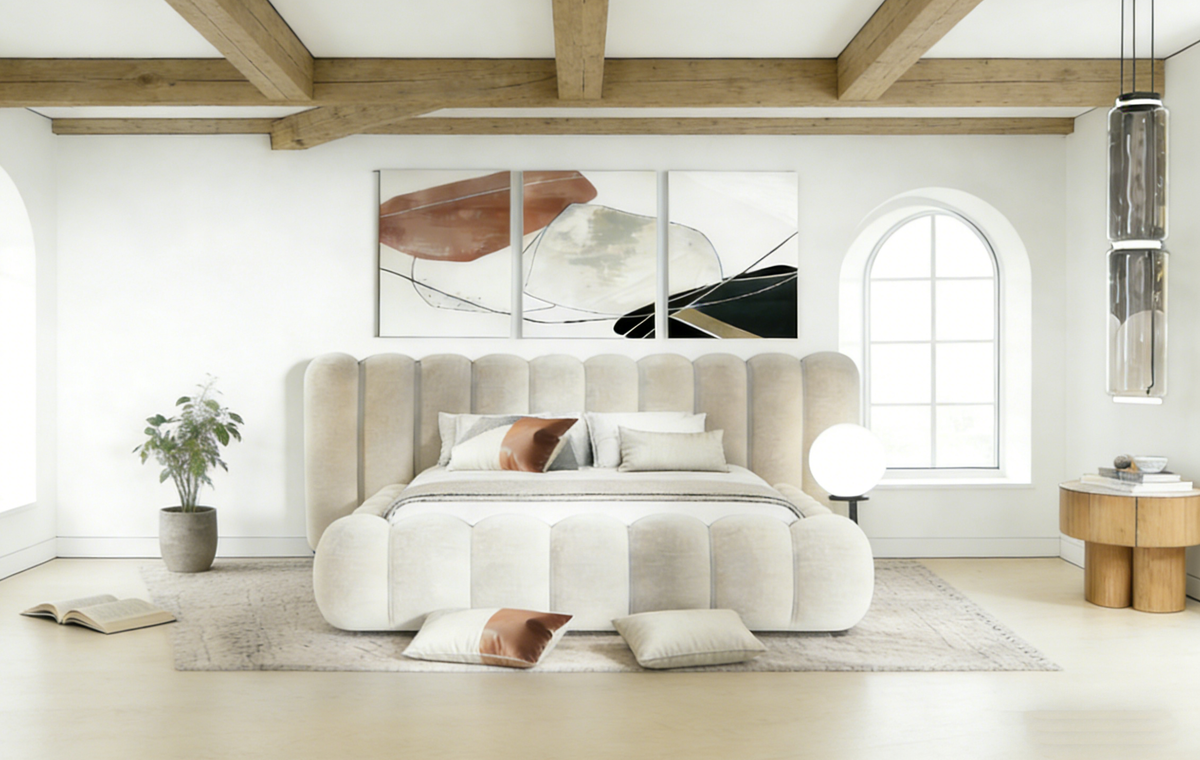 Modern bedroom with a large bed, abstract art on the wall, and wooden beams.