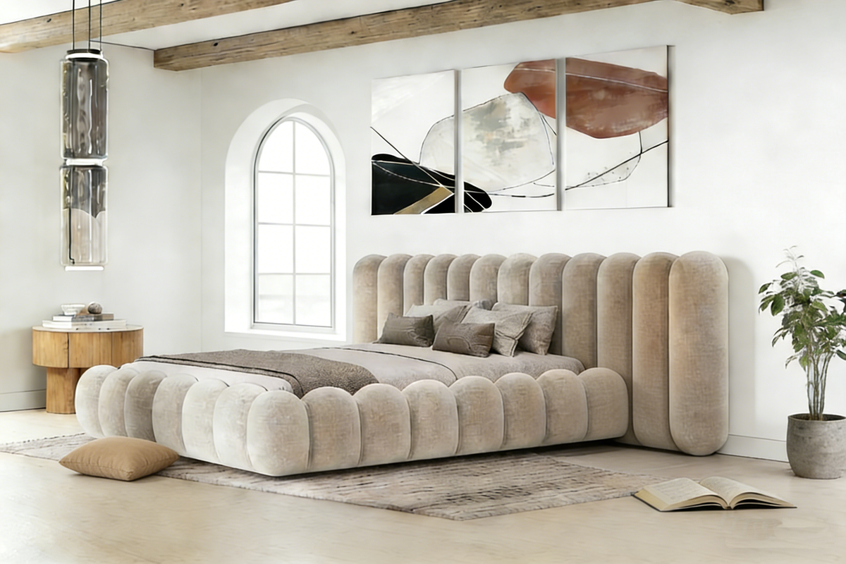 Beige tufted sofa in a modern living room with abstract art on the wall.