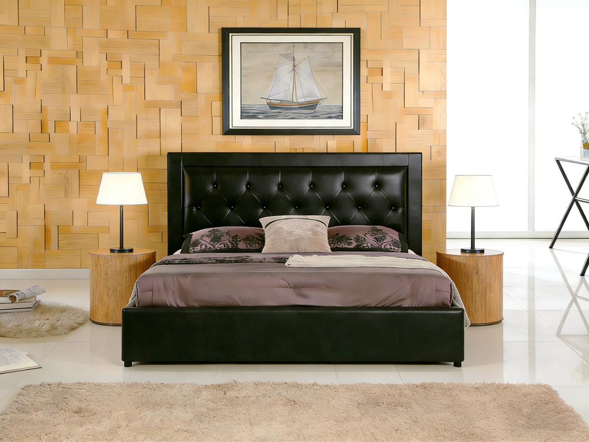 Modern bedroom with a black upholstered bed, wooden wall, and framed picture of a sailboat.