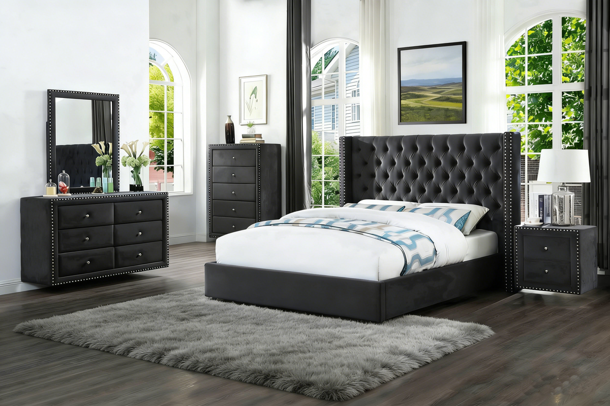 Modern bedroom with black upholstered bed, dresser, and nightstands.