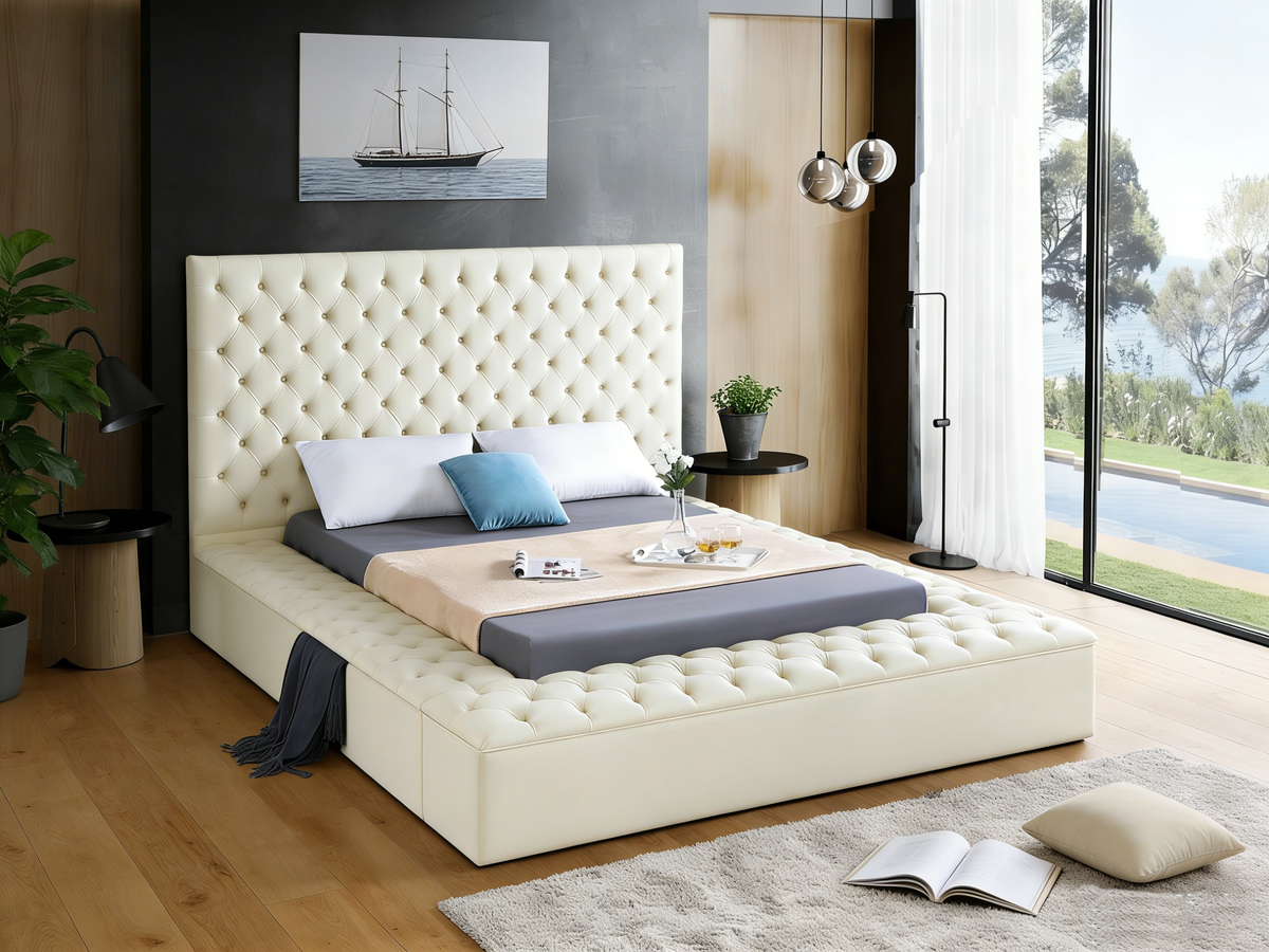 Modern bedroom with a large bed, headboard, and decor elements.