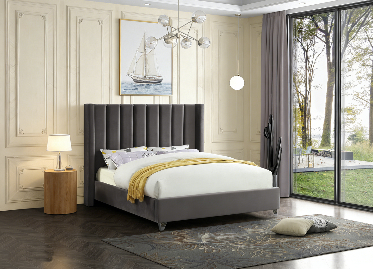 Modern bedroom with gray upholstered bed, white bedding, and a yellow throw blanket.