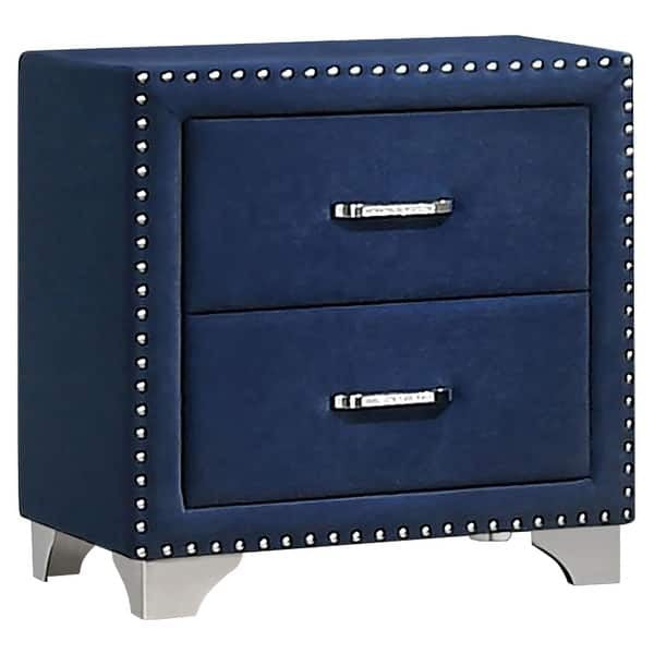Blue nightstand with two drawers and studded details on a white background