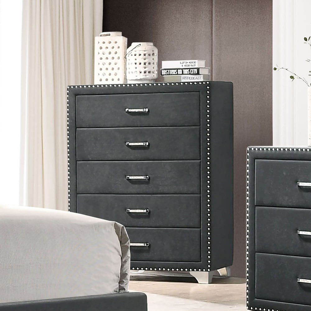 Gray dresser with studded details in a bedroom setting