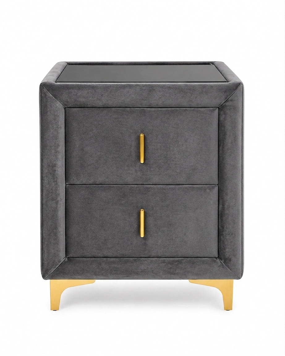 Gray nightstand with gold legs and handles on a white background
